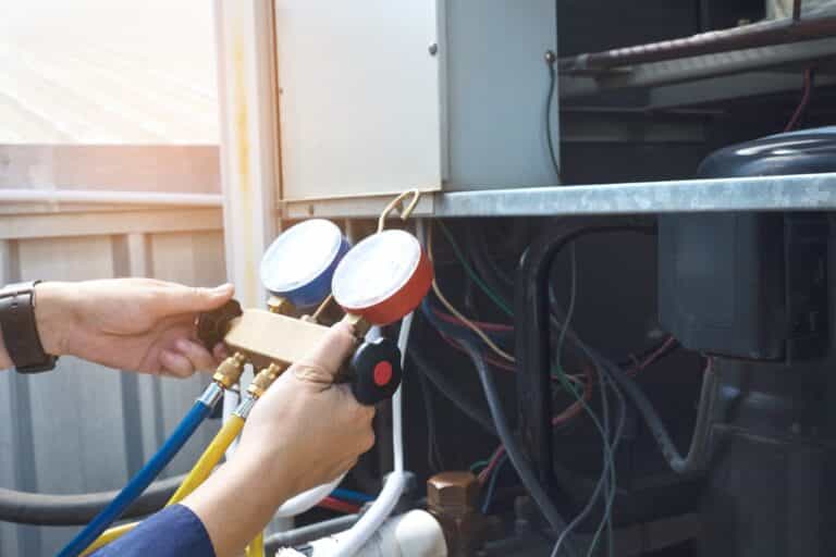 Technician is checking air conditioner